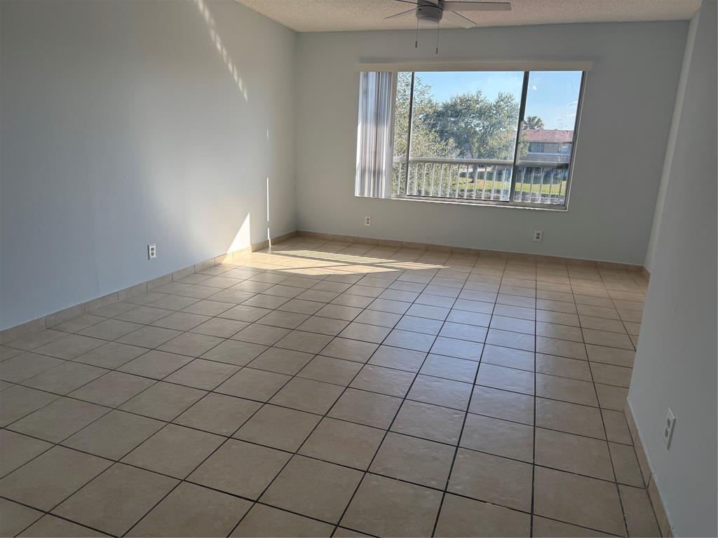 9930 Twin Lakes Drive, Unit 7L Coral Springs, FL 33071 - Photo 10 of 39 a view of an empty room and window