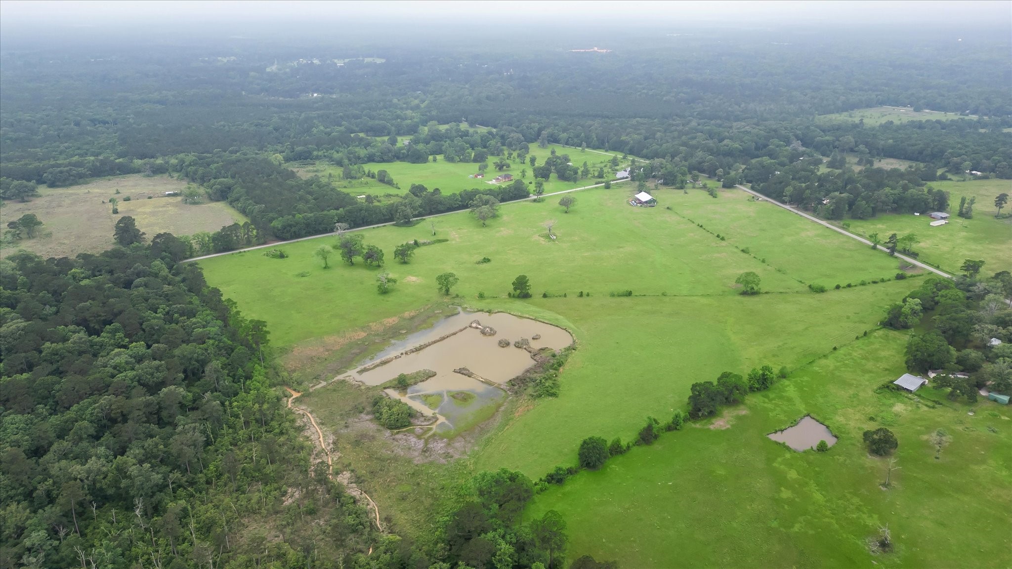 2760 Stringtown Road Shepherd, TX 77371 - Photo 18 of 46 an aerial view of a house with a yard