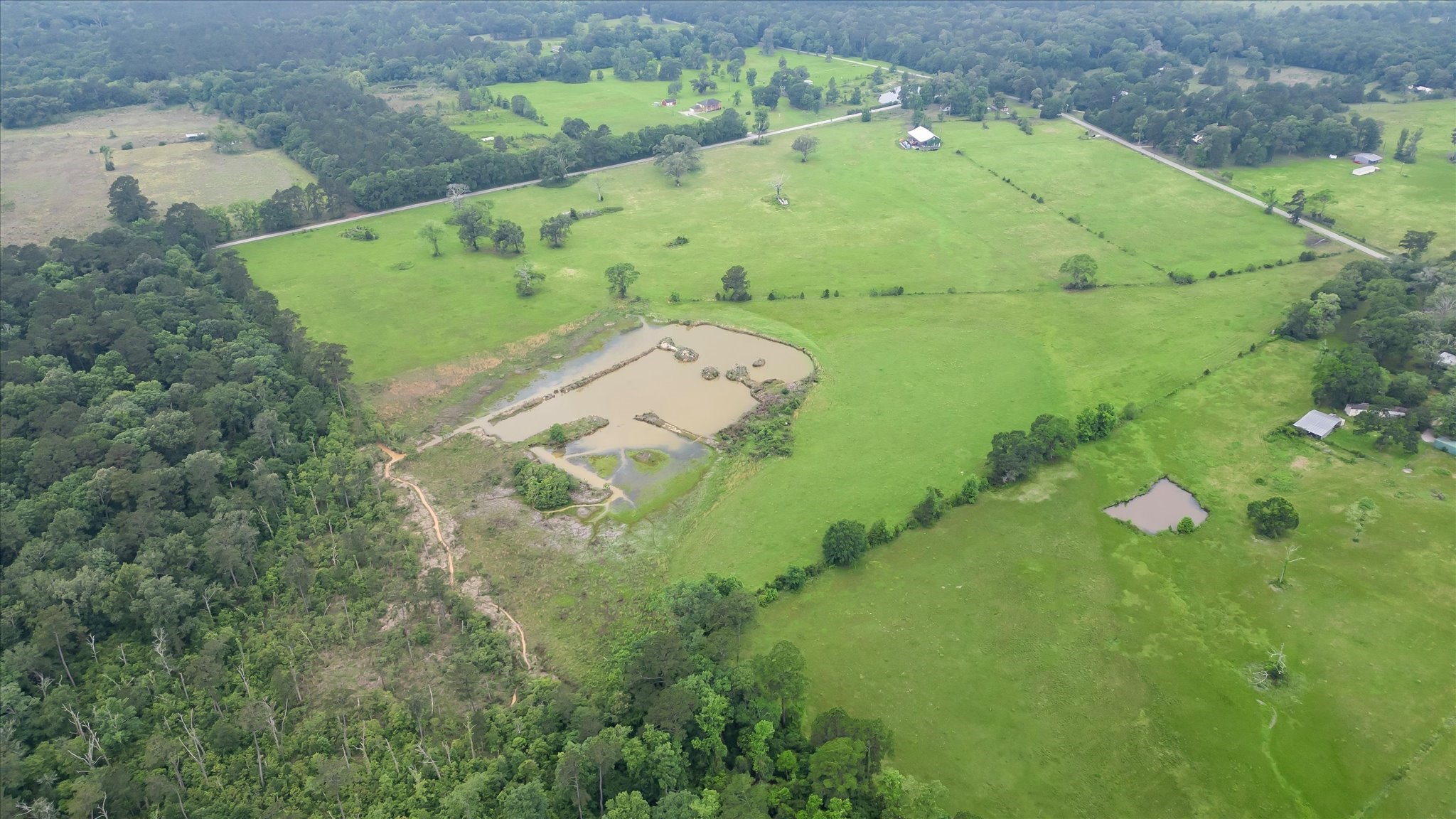 2760 Stringtown Road Shepherd, TX 77371 - Photo 25 of 46 an aerial view of a residential houses with outdoor space
