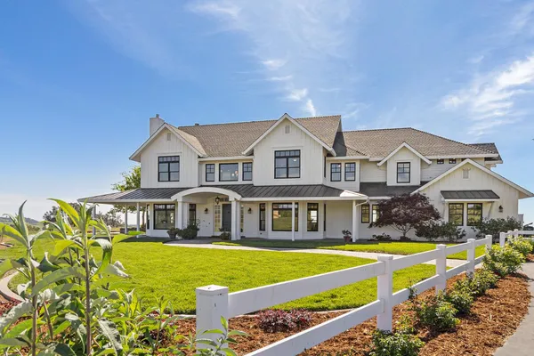 a front view of a house with swimming pool