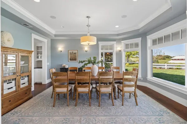a living room with furniture large window and a fireplace