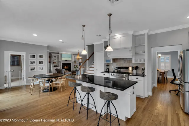 a large kitchen with a table and chairs