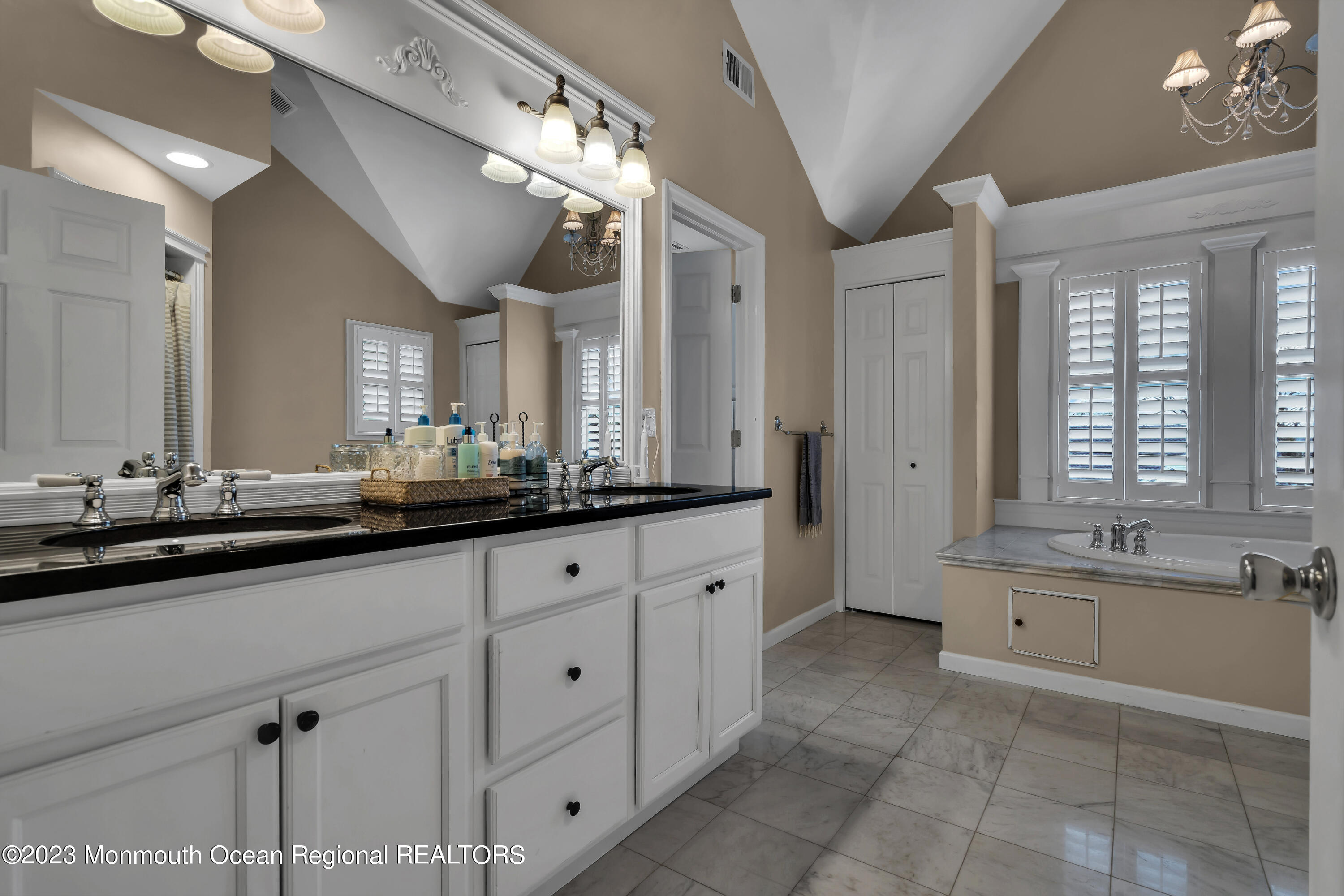 89 Mclean Avenue Manasquan, NJ 08736 - Photo 21 of 38 a bathroom with double sink and a large mirror