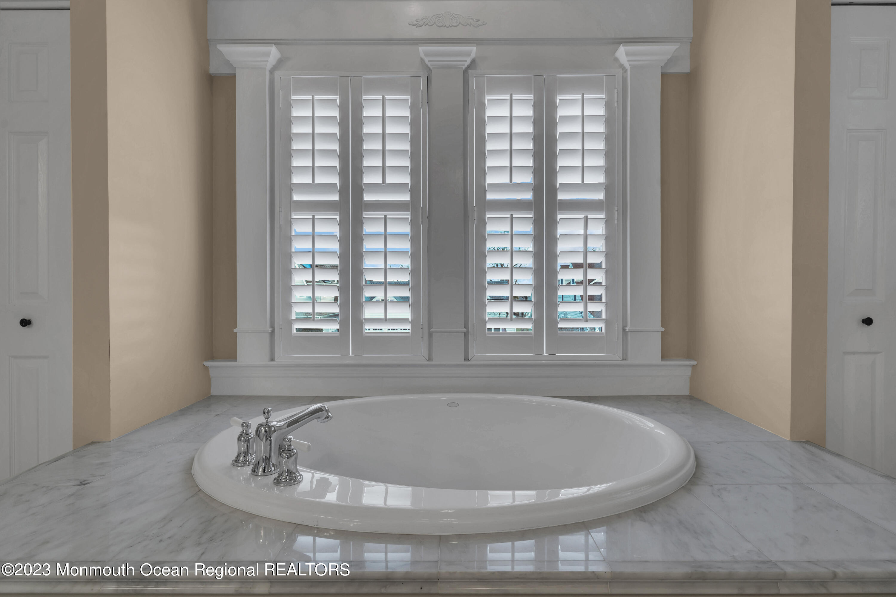 89 Mclean Avenue Manasquan, NJ 08736 - Photo 22 of 38 a white bath tub sitting in a bathroom next to a window