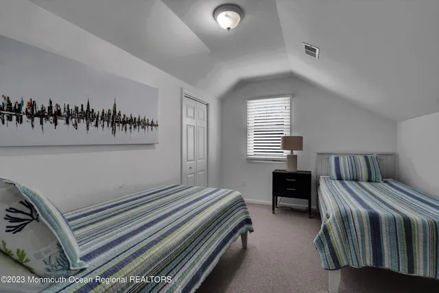 a bedroom with a bed and a table in it