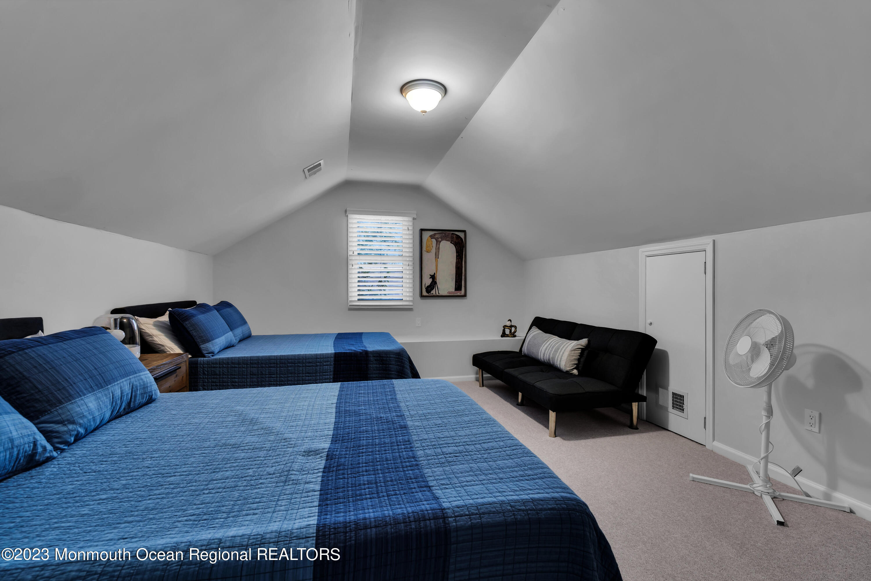 89 Mclean Avenue Manasquan, NJ 08736 - Photo 28 of 38 a living room with furniture and a lamp