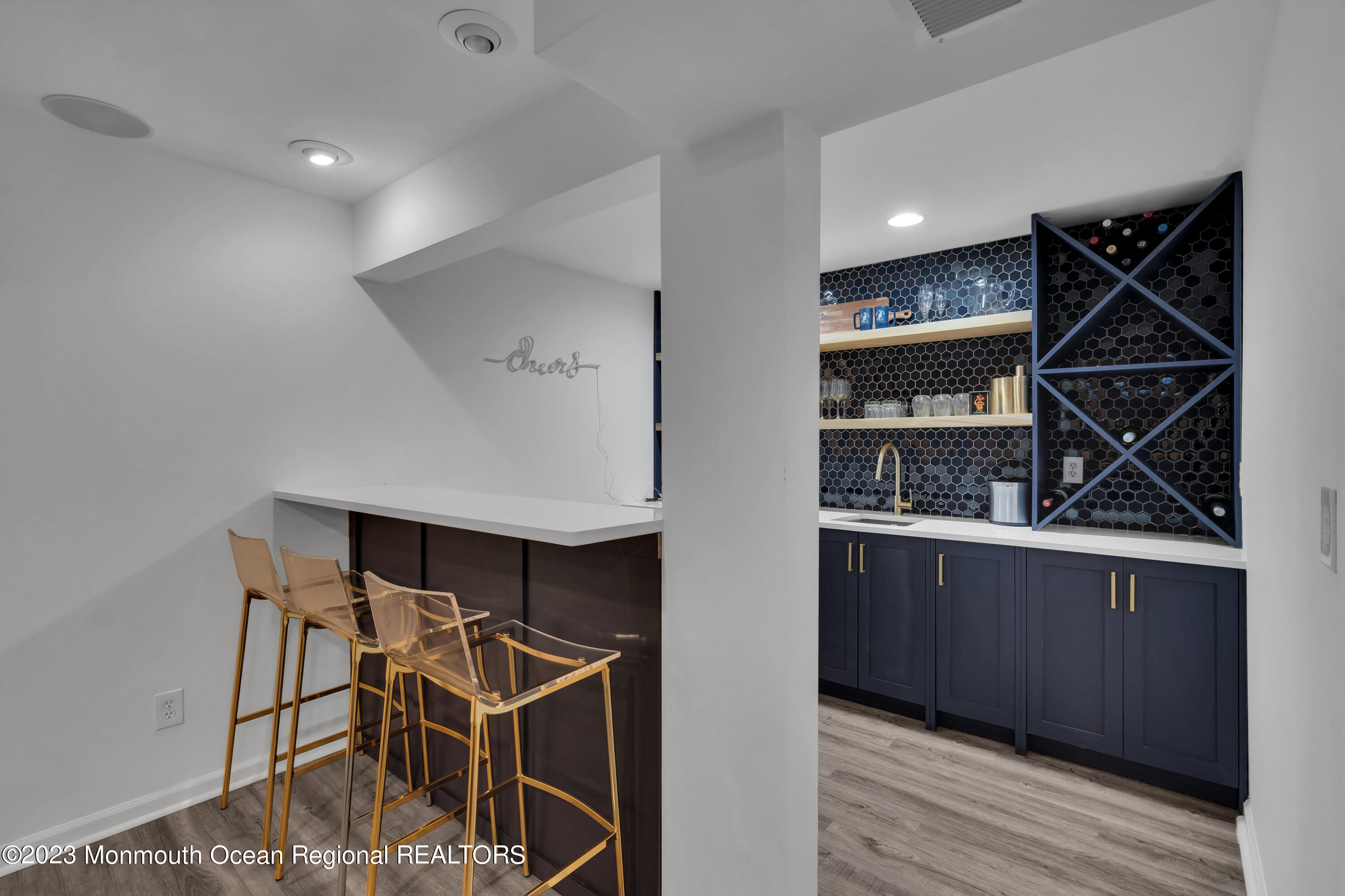 89 Mclean Avenue Manasquan, NJ 08736 - Photo 30 of 38 a room with cabinets and wooden floor