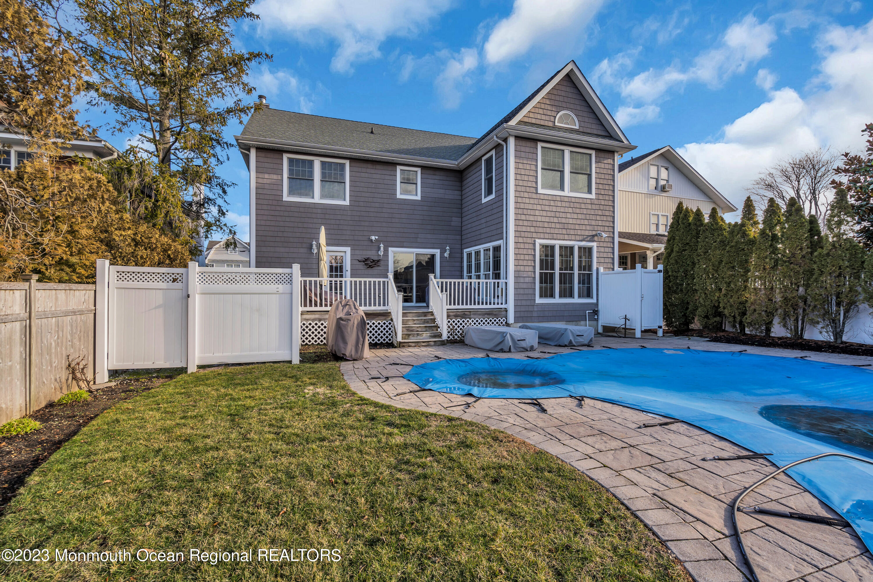 89 Mclean Avenue Manasquan, NJ 08736 - Photo 36 of 38 a front view of a house with a yard