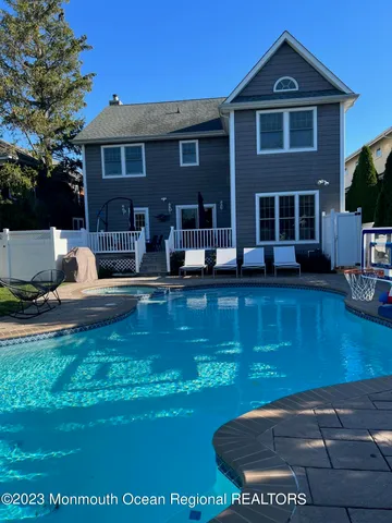 a view of house with yard in front of house