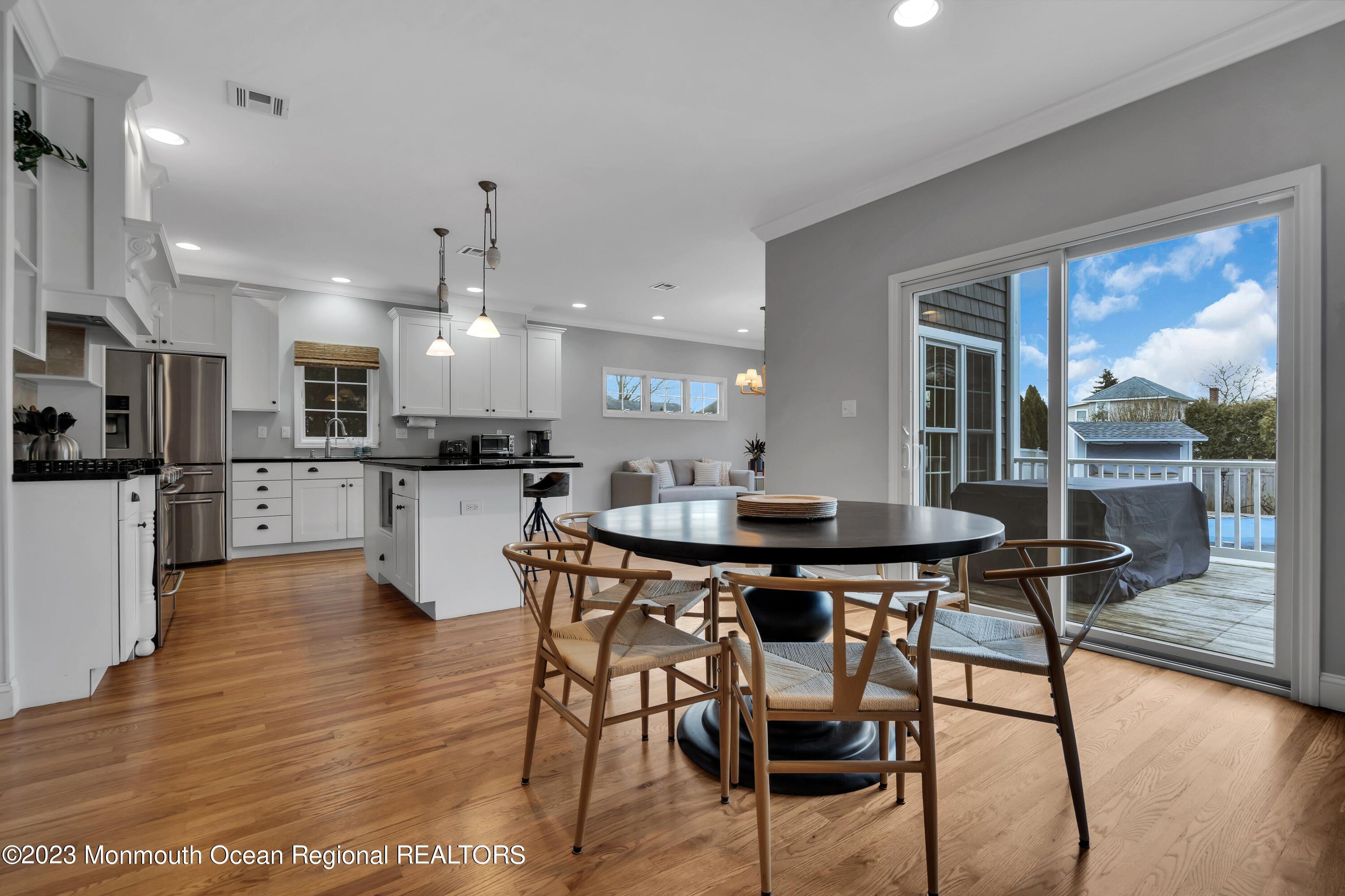 89 Mclean Avenue Manasquan, NJ 08736 - Photo 10 of 38 a view of a dining room with furniture and wooden floor