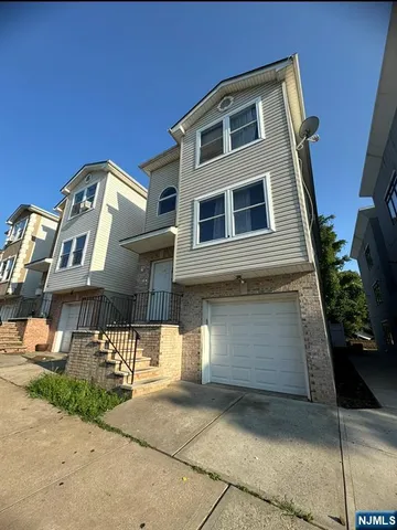 a front view of a house with parking