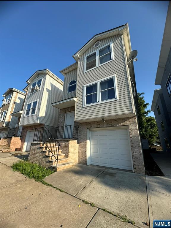 a front view of a house with parking