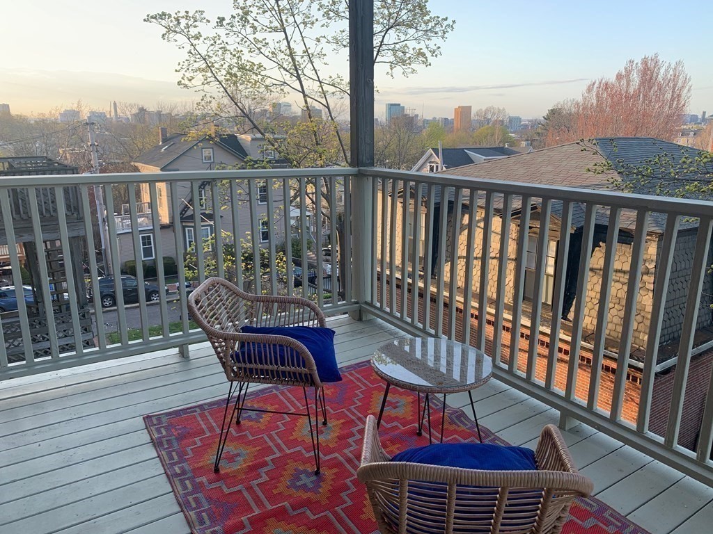 25 Fort Avenue, Unit 2 Boston, MA 02119 - Photo 11 of 12 a view of a balcony with furniture