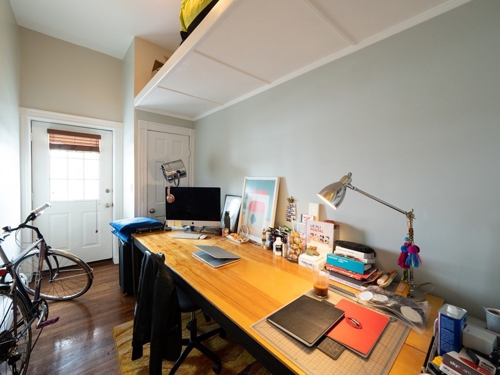 25 Fort Avenue, Unit 2 Boston, MA 02119 - Photo 10 of 12 a workspace with furniture and window