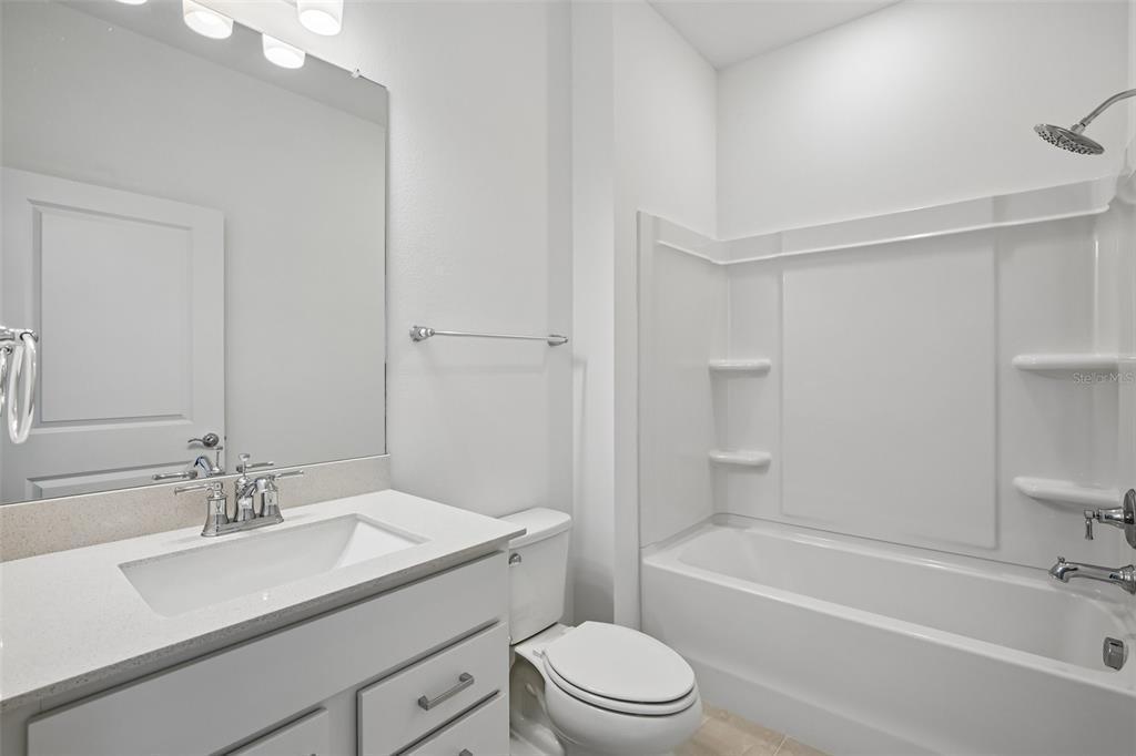 9932 Redwood Rdg Avenue Riverview, FL 33578 - Photo 19 of 38 a bathroom with a sink a toilet and shower