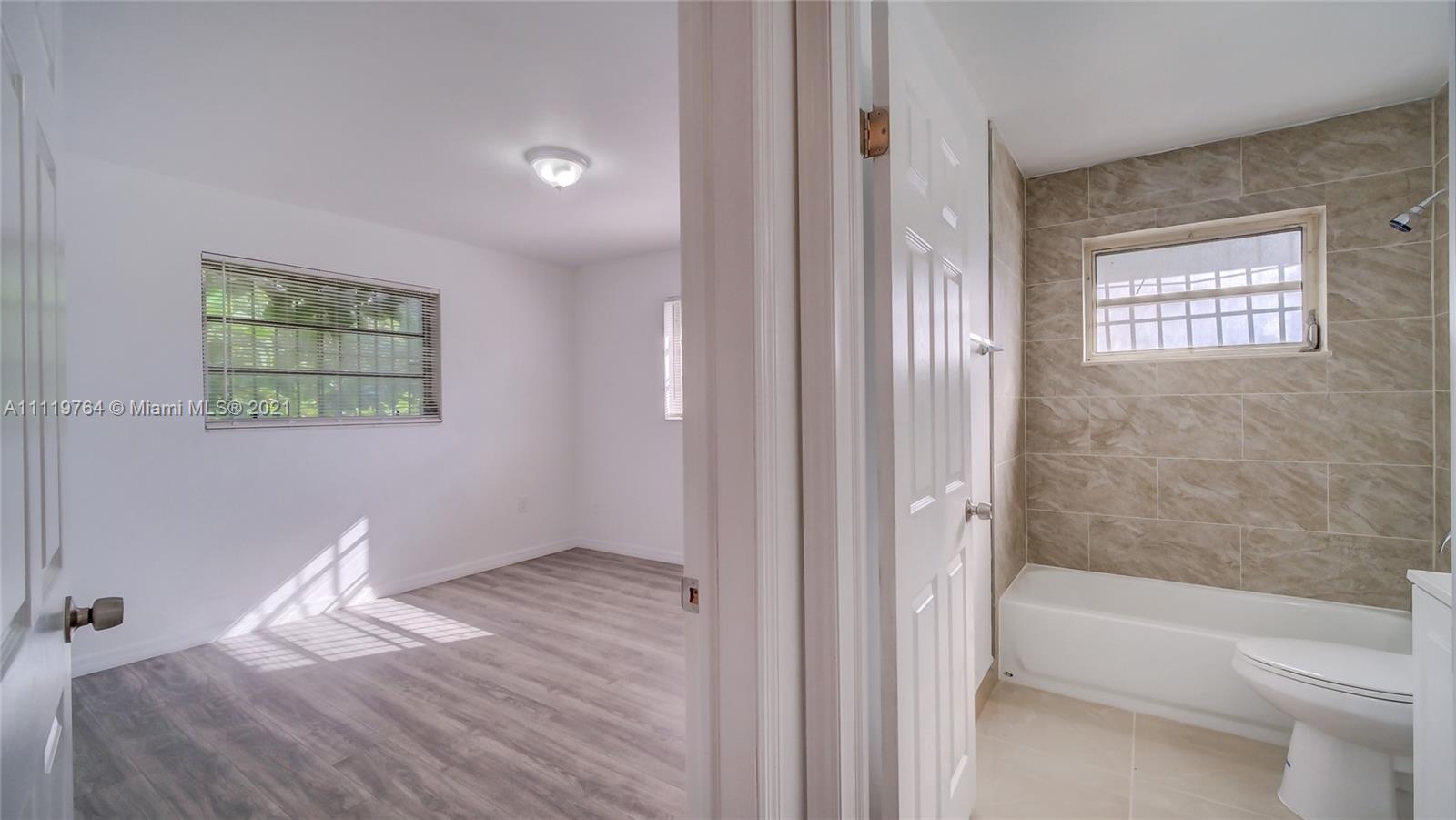 a bathroom with a bathtub sink and toilet