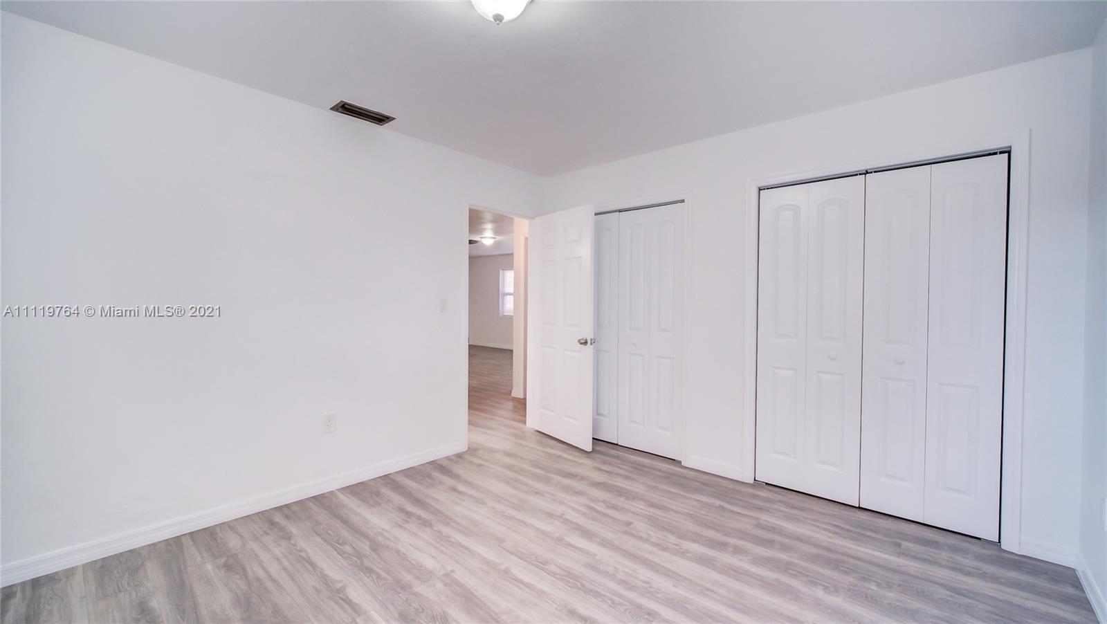 285 Northwest 97th Street Miami, FL 33150 - Photo 11 of 28 a view of an empty room and wooden floor