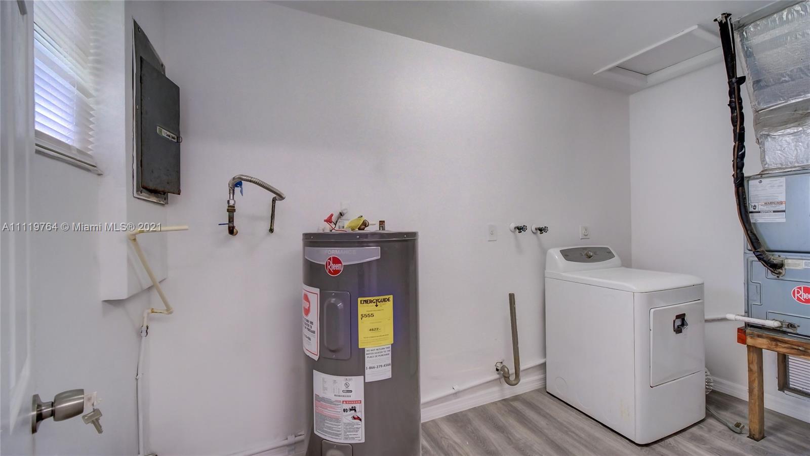 285 Northwest 97th Street Miami, FL 33150 - Photo 13 of 28 a utility room with dryer and washer