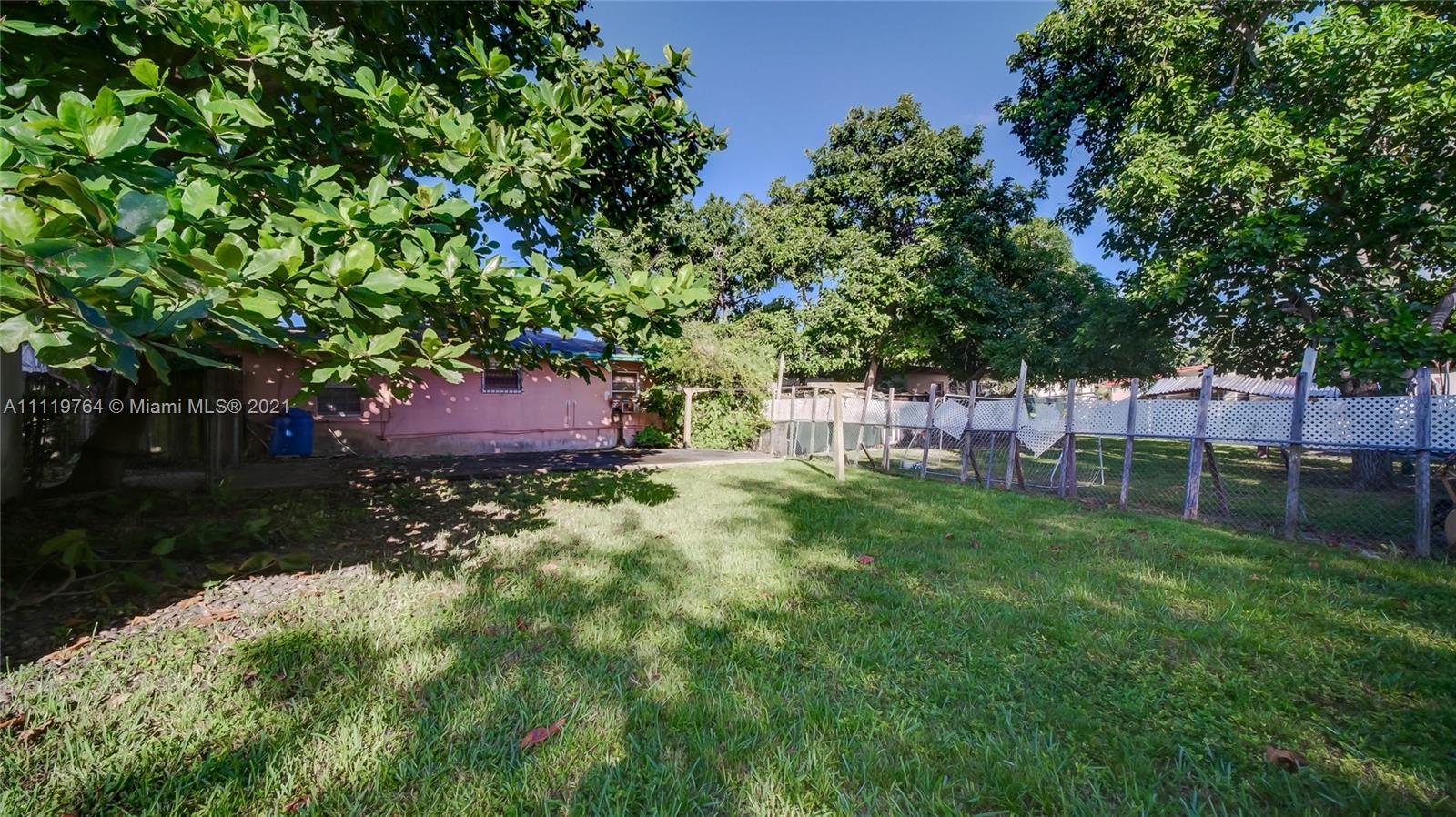 285 Northwest 97th Street Miami, FL 33150 - Photo 24 of 28 a garden view with a seating space