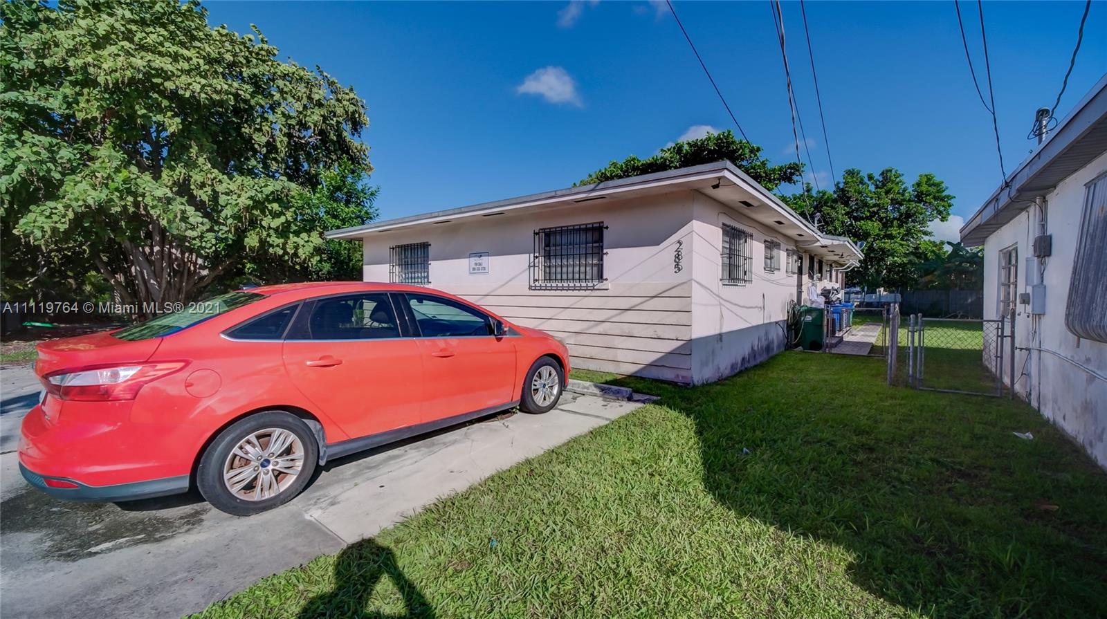 285 Northwest 97th Street Miami, FL 33150 - Photo 27 of 28 a car parked in front of a house