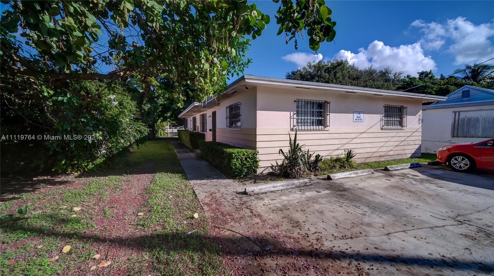 285 Northwest 97th Street Miami, FL 33150 - Photo 28 of 28 a view of a car park in front of a house