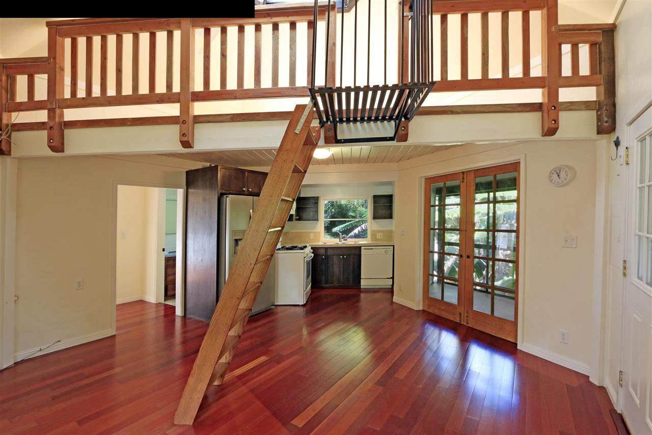 11 Kane Place Haiku, HI 96708 - Photo 11 of 30 wooden floor in an empty room with a window