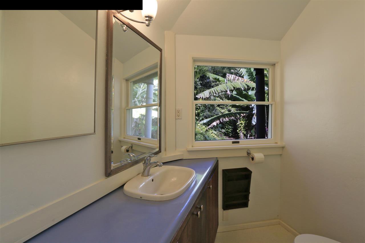 11 Kane Place Haiku, HI 96708 - Photo 14 of 30 a bathroom with a sink and a mirror