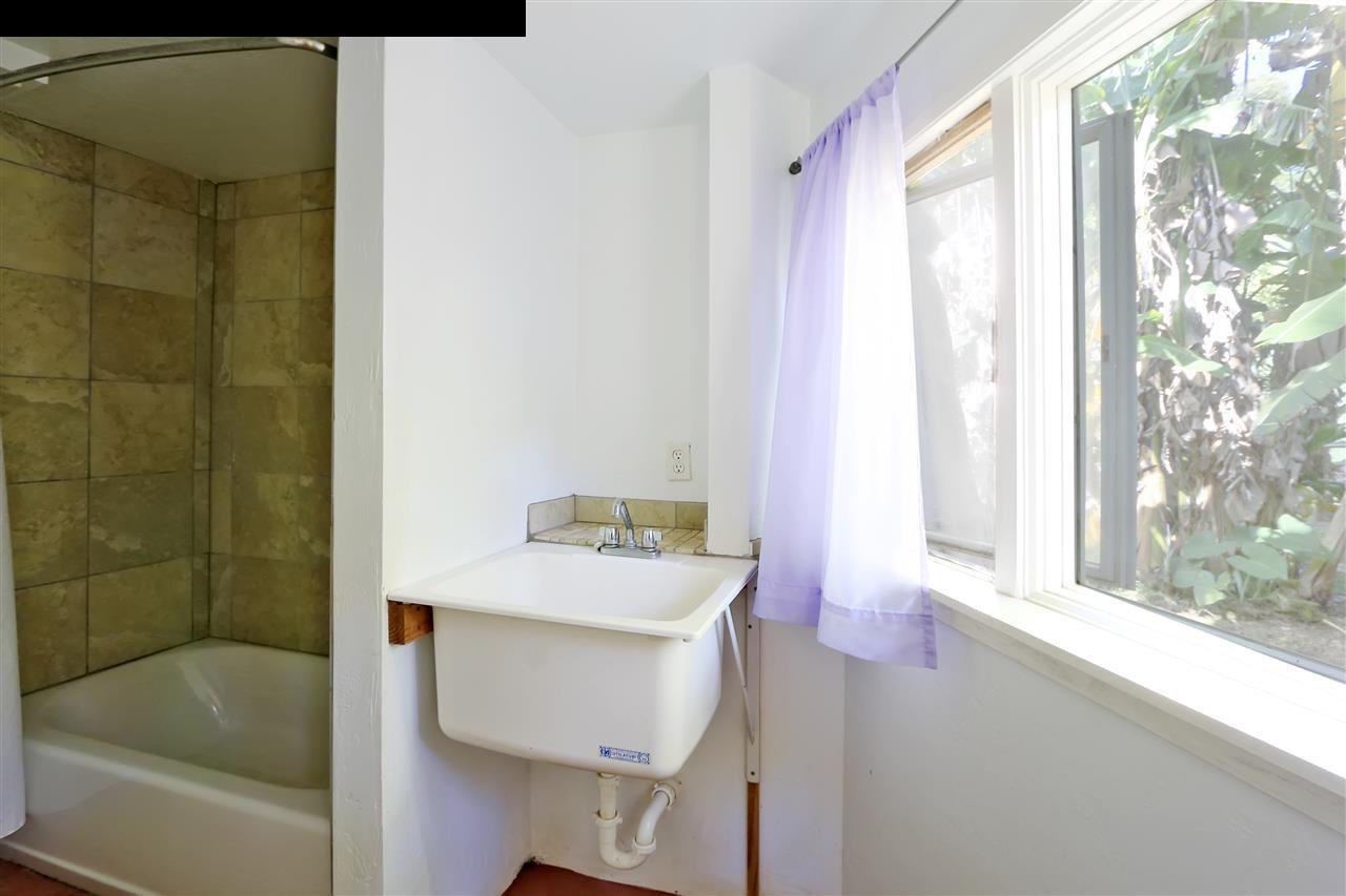 11 Kane Place Haiku, HI 96708 - Photo 15 of 30 a bath room with a sink and a bath tub