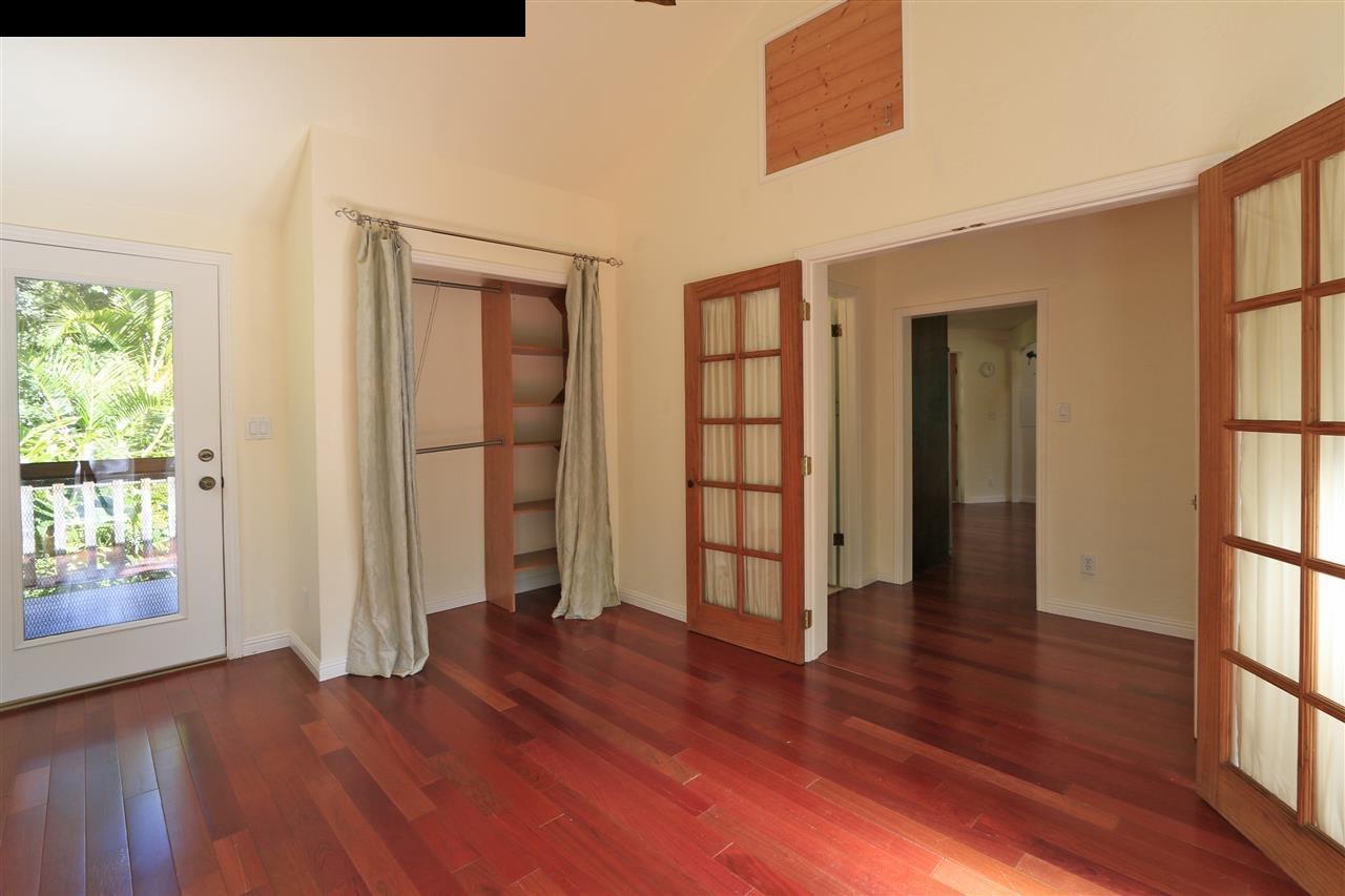 11 Kane Place Haiku, HI 96708 - Photo 16 of 30 an empty room with wooden floor and windows