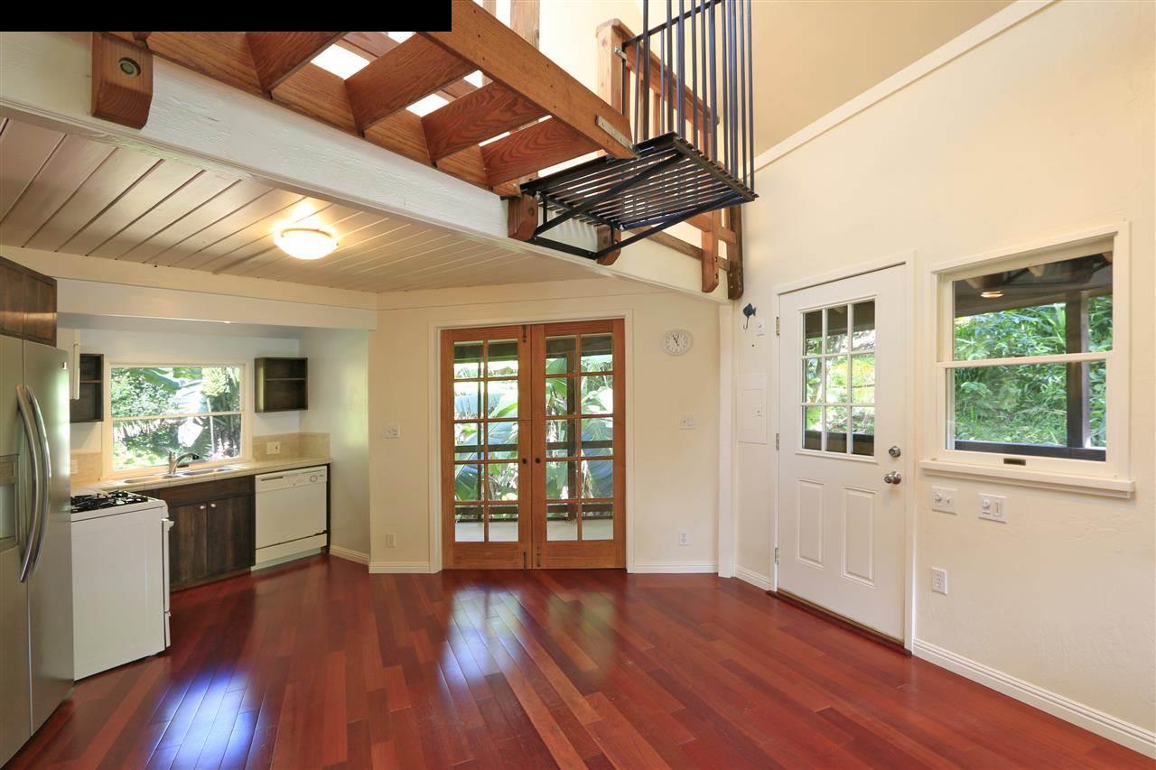 11 Kane Place Haiku, HI 96708 - Photo 2 of 30 a view of an empty room with wooden floor and a window