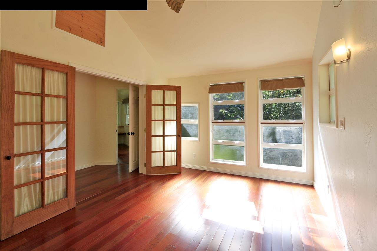 11 Kane Place Haiku, HI 96708 - Photo 4 of 30 wooden floor in an empty room with a window