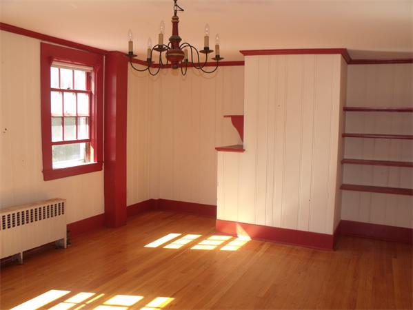 307 Harvard Road Bolton, MA 01740 - Photo 11 of 26 an empty room with wooden floor closet and windows
