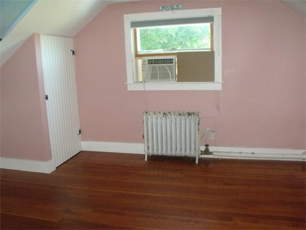 307 Harvard Road Bolton, MA 01740 - Photo 14 of 26 an empty room with wooden floor and windows