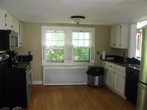 307 Harvard Road Bolton, MA 01740 - Photo 3 of 26 a kitchen with a window a sink and a stove