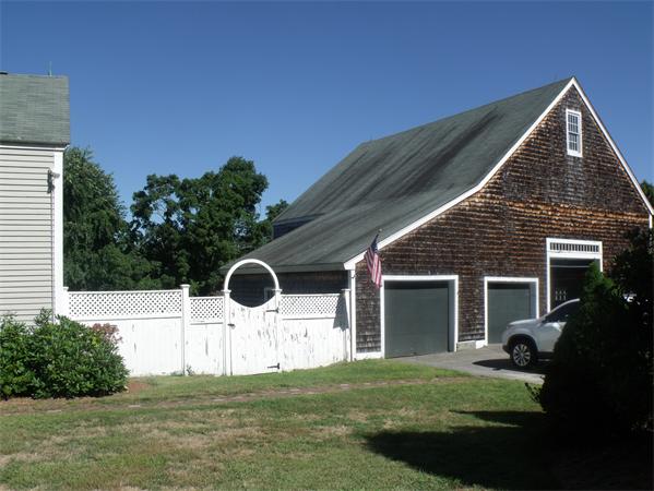 307 Harvard Road Bolton, MA 01740 - Photo 6 of 26 a backyard of a house with yard and outdoor seating