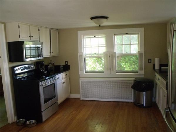 307 Harvard Road Bolton, MA 01740 - Photo 7 of 26 a kitchen with granite countertop a stove a sink and a refrigerator