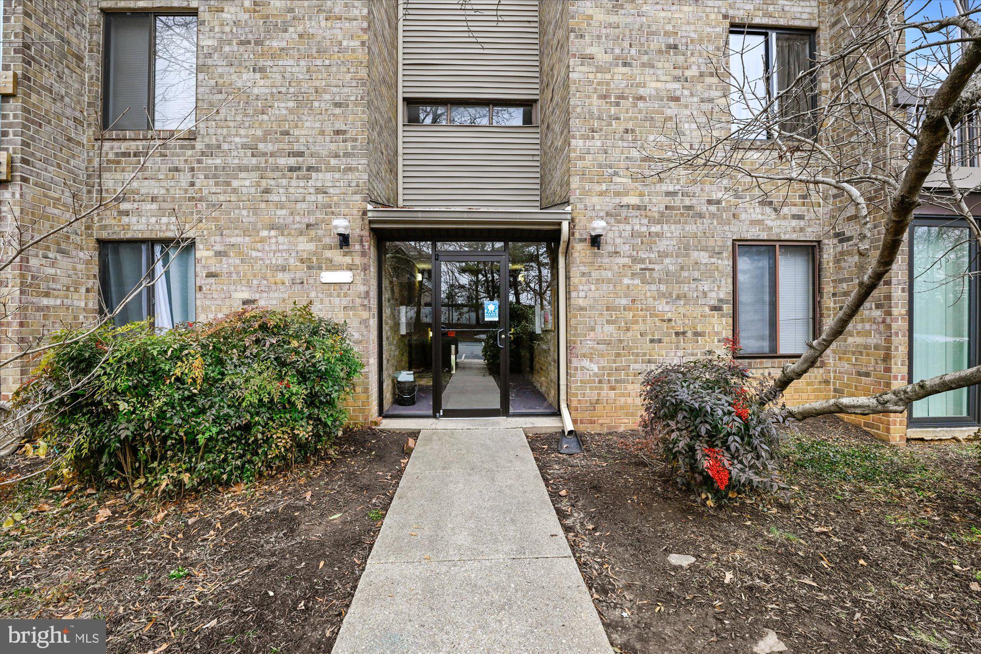10578 Cross Fox Lane, Unit E2 Columbia, MD 21044 - Photo 1 of 28 a view of a pathway with a house in the background