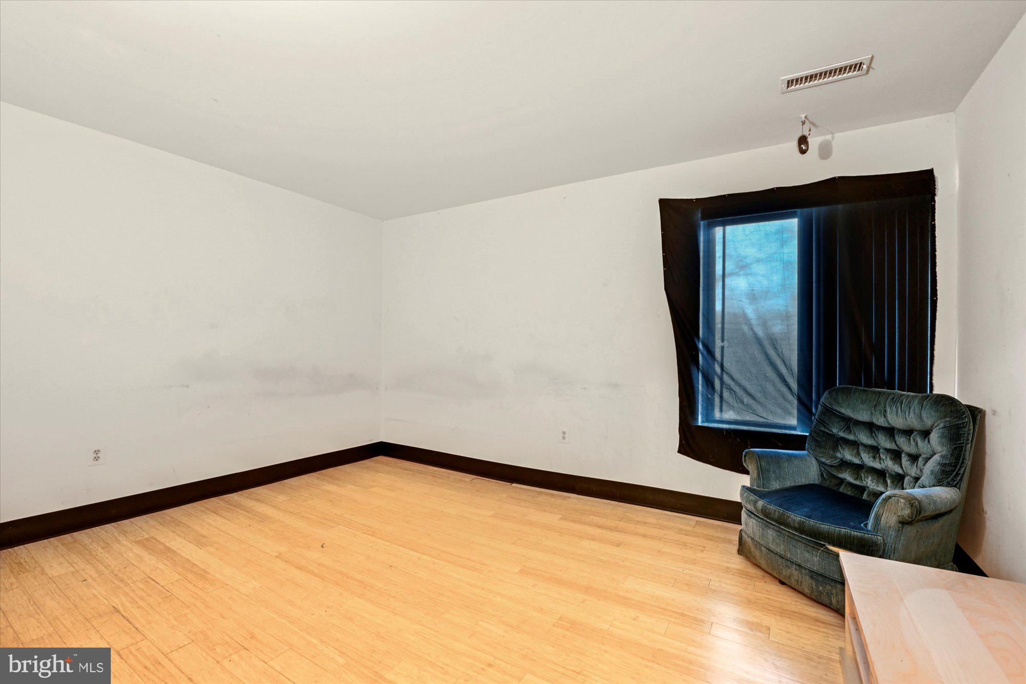 10578 Cross Fox Lane, Unit E2 Columbia, MD 21044 - Photo 25 of 28 a view of a room with wooden floor and a window