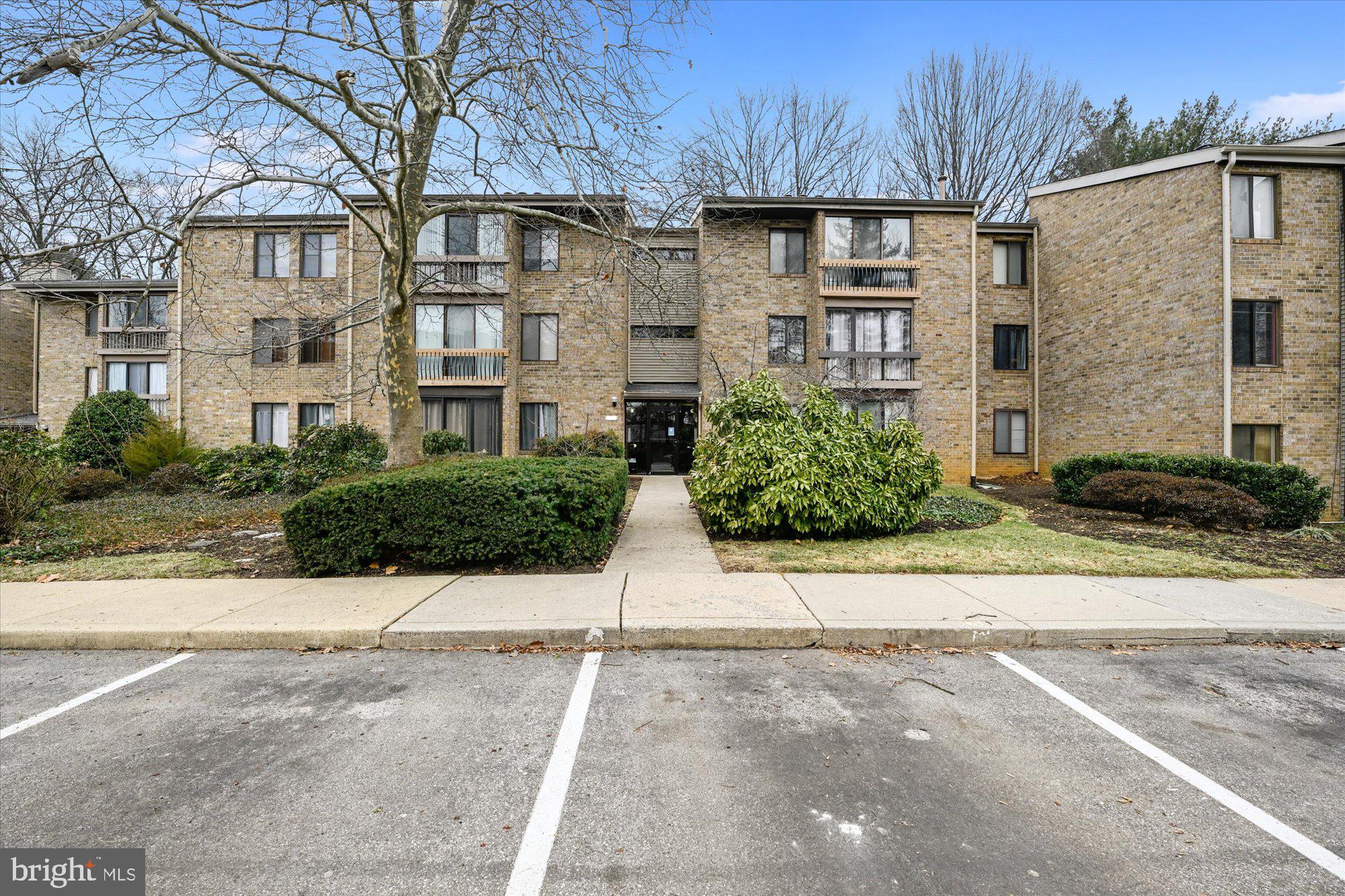 10578 Cross Fox Lane, Unit E2 Columbia, MD 21044 - Photo 28 of 28 a view of a brick building next to a road
