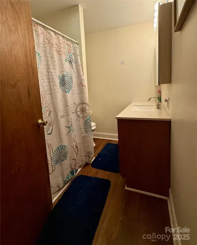 a bathroom with a sink and mirror