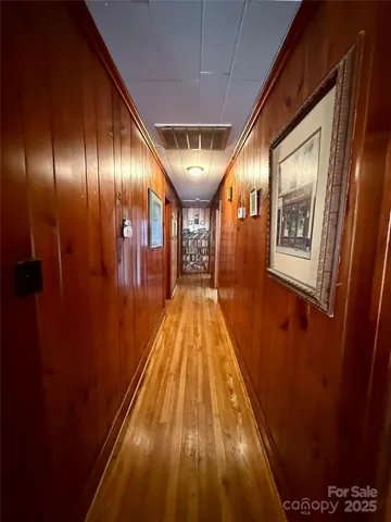 a view of gallery with wooden floor