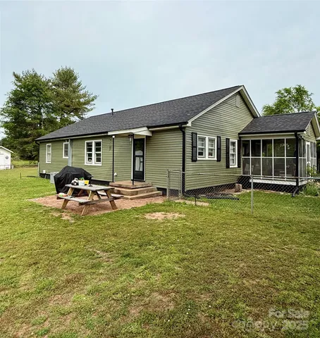 a house view with swimming pool and porch