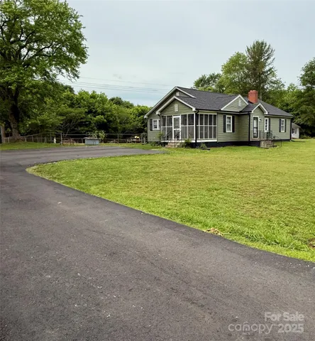 a front view of house with an outdoor space and balcony