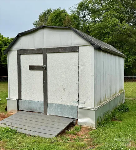 a house with trees in the background