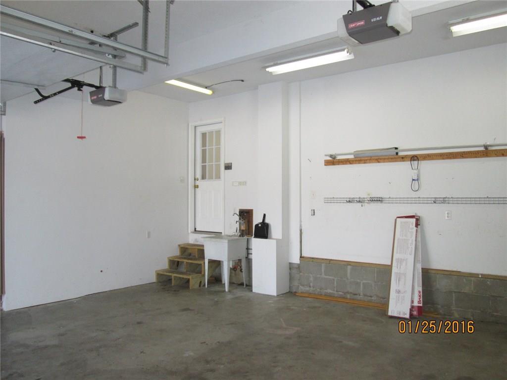 335 Myoma Road Mars, PA 16046 - Photo 18 of 20 Over-sized, over-height 2-car garage with area for work bench, etc. Steps and door to Kitchen eating area. There are also garage steps to full basement