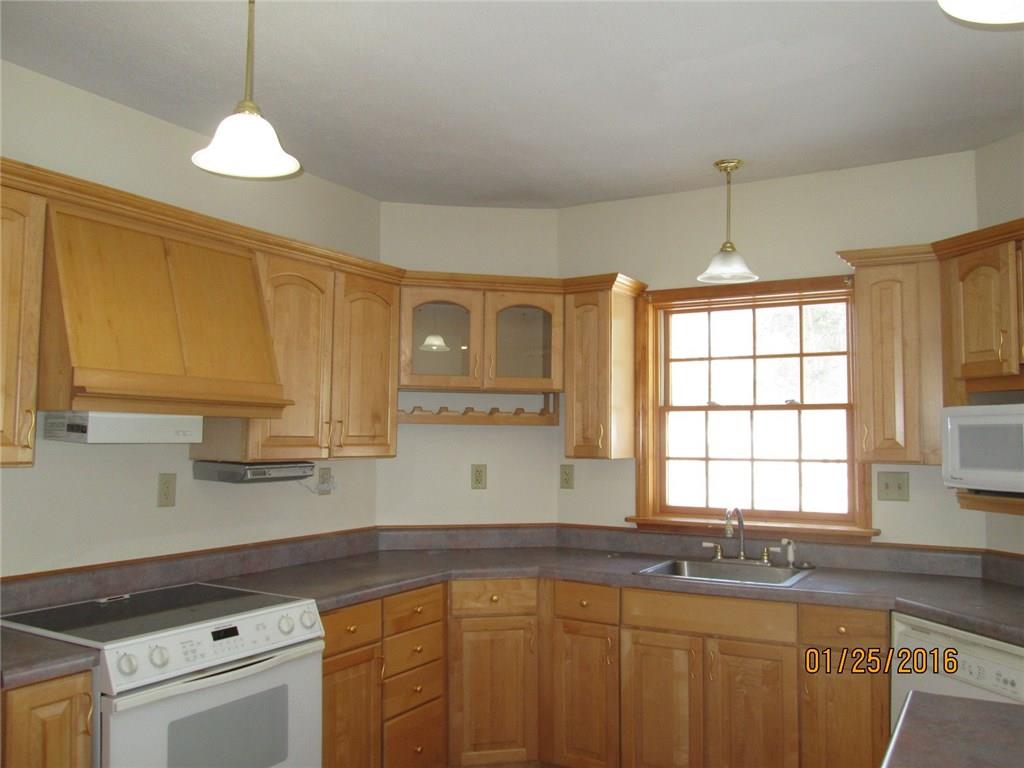 335 Myoma Road Mars, PA 16046 - Photo 4 of 20 Bright Maple Kitchen featuring island and step-down to eating area with sliding glass doors to deck