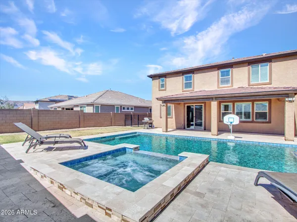a front view of a house with a yard and a garage