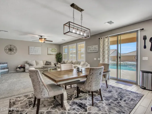 a view of walk in closet with clothes