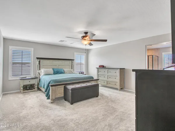a view of a patio with couches under an umbrella
