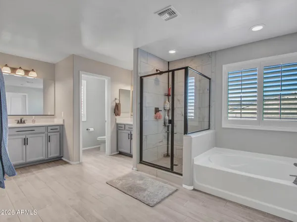 an aerial view of a city with lots of residential buildings and ocean view